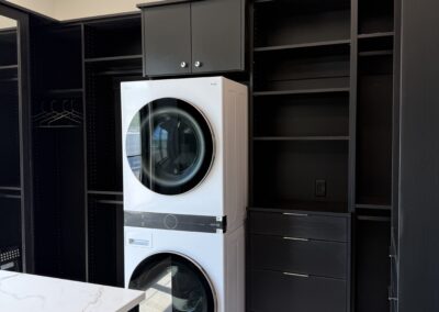 Walk in closet with safe and washer/dryer
